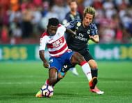 GRANADA, SPAIN - MAY 06:  Martin Hongla of Granada CF (L) competes for the ball with Fabio Coentrao of Real Madrid CF (R) during the La Liga match between Granada CF v Real Madrid CF at Estadio Nuevo Los Carmenes on May 6, 2017 in Granada, Spain.  (Photo by Aitor Alcalde/Getty Images)